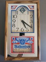 Front view showing entire mirrored Budweiser bar clock