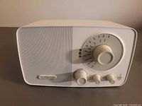 Front view of Cambridge SoundWorks Radio 705 showing speaker grille, tuning dial, control knobs