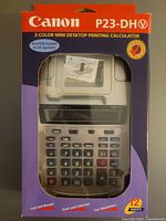 Front of sealed box showing Canon P23-DH V calculator image and specs