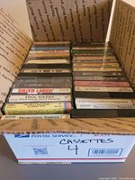 Open box showing entire group of cassette tapes