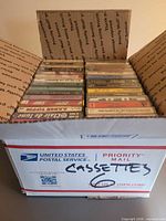 Box holding two rows of cassette tapes