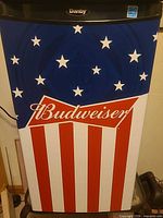 Front view showing Budweiser stars and stripes wrap and Danby logo