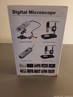 Front of retail box showing product images and Digital Microscope branding