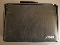 Front view of black DocSafe battery organizer bag with logo