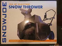 Front of sealed box showing product image, brand, model, 13A 18" rating