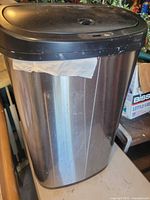 Full view of stainless steel electric trash can front