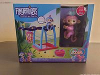 Front of sealed Fingerlings playset box