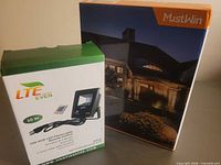 Two unopened boxes: LTE Lighting EVEN flood light and MustWin LED spotlight 4-pack