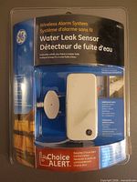 Front view of sealed GE wireless water leak sensor package