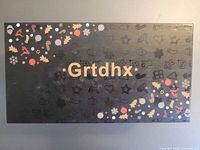 Retail box top with Grtdhx branding