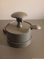 Patty press assembled with plunger knob visible