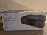Front of sealed box showing Insignia stereo receiver with Bluetooth