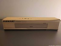 Front view of boxed Insmart soundbar