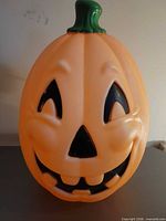 Front view of pumpkin blow mold showing jack-o-lantern face