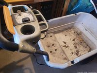 Top view showing hopper interior, control panel with cup holders and lever, overall construction