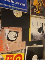 Top view showing multiple records including Gap Band, LIS album, black sleeves