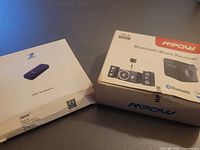 Two boxed Bluetooth receivers side by side