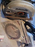Grey Craftsman circular saw and packaged blades
