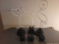 Front view of three neon lights and adapters