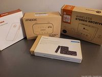 All four boxed Bluetooth audio receivers grouped