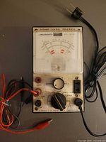 Full view of Micronta tester with attached leads