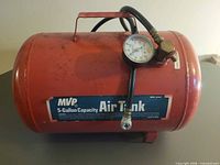 Full view of red MVP 5-gallon air tank showing body, handle and attached hose