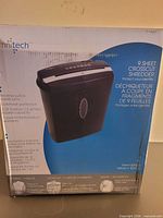 Front of sealed Omnitech shredder box showing product image and features