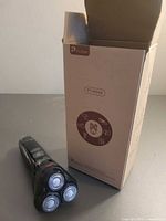 Razor beside original box