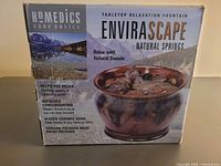 Front of boxed HoMedics Envirascape Natural Springs tabletop fountain