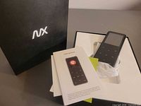 Player inside open box with manual and packaging