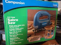 Front of sealed retail box showing Companion 3.2 Amp Sabre Saw and listed features