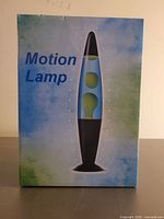 front view of boxed motion lava lamp