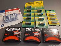 Overview of all battery packs and cards on table