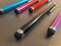 Five stylus pens on surface showing colours and tips