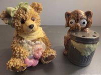 Bear and dog figurines side by side