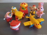 Group view of seven wind-up toys