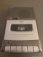 Front view showing RCA RP503 cassette recorder, speaker grille, cassette window, control buttons