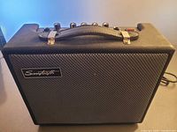 Front of Sawtooth portable amplifier showing grille and logo