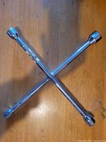 Full view of chrome cross tire iron showing all four socket ends