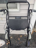 Full front view of U-Step walker showing frame, wheels, brakes and seat