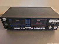 Front view of LXI dual cassette deck showing both tape wells and control panel
