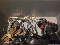 Overall view inside case showing soldering gun and cables