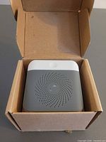 Receiver in box showing front grille and LED