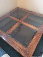 Top view showing four glass panels in wooden frame