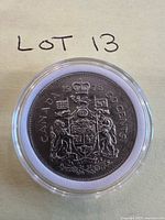 Reverse side of 1978 Canadian 50-cent coin in capsule