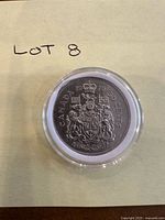 Reverse showing Canadian coat of arms and date