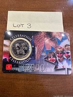 Full presentation card showing sealed 2000 Celebration quarter
