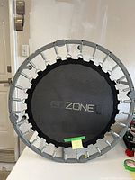 Front view showing full trampoline with branding