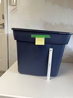 Entire Rubbermaid tote with ruler for scale