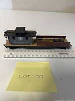 Side view of maintenance car showing cabin, flatbed and markings